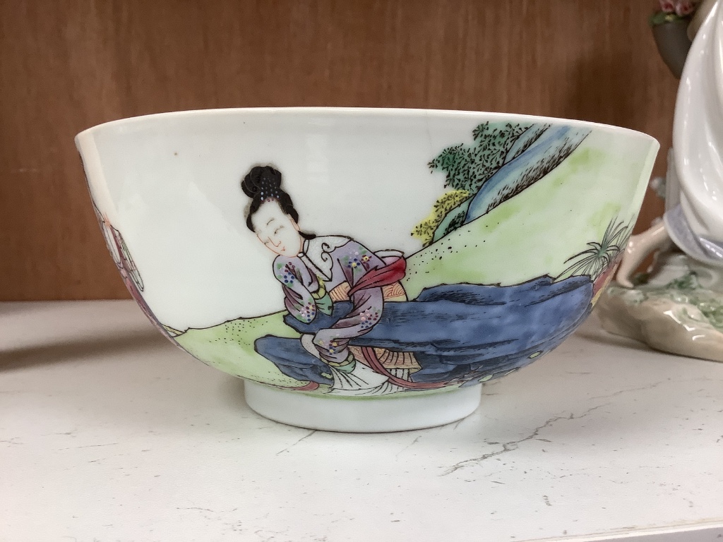 A Chinese blue and white footed porcelain bowl, Kangxi mark to underside, c1900, 12cm diameter 6cm high, together with a further hand painted famille rose, 15cm diameter, 7cm high